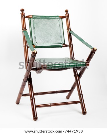 Wooden folding chair with leather trim on a white background