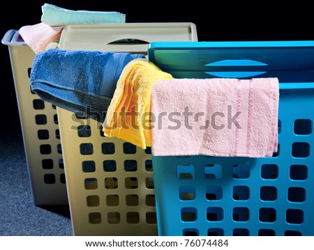 Plastic laundry baskets in different colors