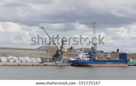 SAINT-MALO, FRANCE - JULY 6: Cargo ship \'Jason\' under the flag of Monrovia, Liberia in the harbor of Saint-Malo, France on July 6, 2011. The ship is 90m long and the tonnage are 3686 tons.