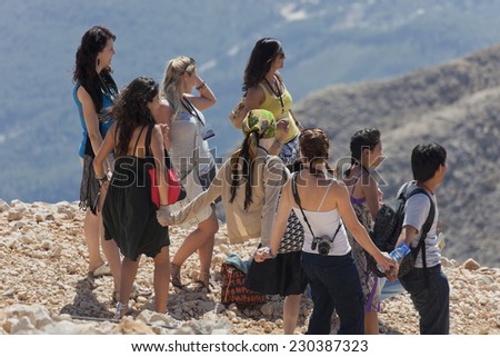 TEKIROVA, TURKEY - OCTOBER 07, 2009: Fashion models posing for the shooting of a television show on the Tahtali Mountain in Tekirova,Turkey on October 7, 2009.