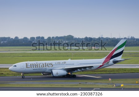 DUESSELDORF, GERMANY - SEPTEMBER, 25, 2011: Airbus A330 of Emirates rolling to gate after landing. This aircraft is a wide-body twin-engine jet airliner with a seating capacity of about 250.