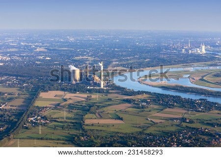 Rhine River bend Orsoy with agricultural, industrial and residential districts in the Lower Rhine Region of Germany - Voerde, North Rhine-Westfalia, Germany, Europe