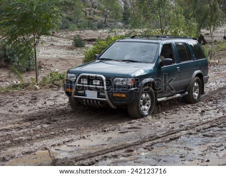OLYMPUS, TURKEY - OCTOBER 14, 2009: Off-Road Vehicle driving on muddy Road after Flood Disaster in Olympos, Turkey.