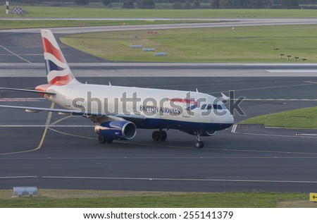 DUESSELDORF, GERMANY - SEPTEMBER 25, 2011: Airbus A319 of British Airways rolling to gate after landing on International Airport. This aircraft has a seating capacity of about 130.