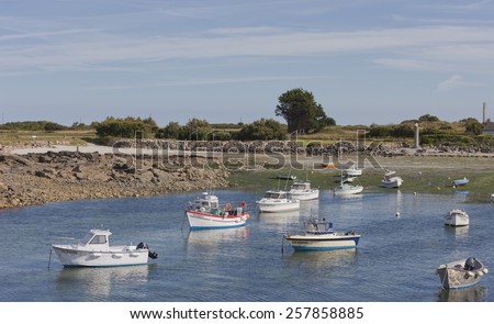 GATTEVILLE-LE-PHARE, FRANCE - JULY 1, 2011: Fishing and recreational boats at low tide in the harbor of Gatteville-le-Phare, France. Gatteville-le-Phare is a picturesque fishing village.