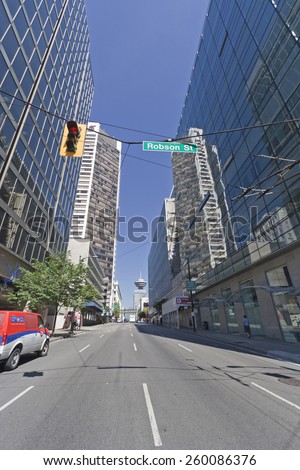 VANCOUVER, CANADA - AUGUST 5, 2005: View from Robson Street into Seymour Street in Vancouver, Canada. On the left is the Scotia Tower, and in the background is the Lookout Tower of Harbour Centre.