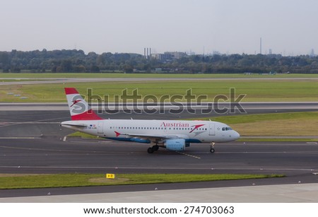 DUESSELDORF, GERMANY - SEPTEMBER 25, 2011: Airbus A319 of Austrian Arrows rolling to gate after landing. This aircraft is a short- to medium-range commercial passenger jet airliner.