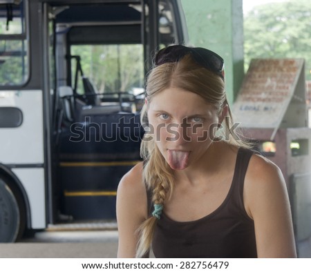 Young woman exhausted after bus tour - Santa Cruz, Costa Rica