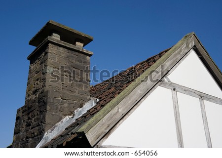 roof of an ancient house of poor people - against a deep blue sky