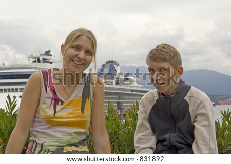 brother and sister in front of a cruise liner - sibling rivalry or sisterly and brotherly love in vancouver