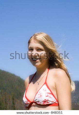 young woman in bikini with long golden hair - enjoying vacation - adobe RGB