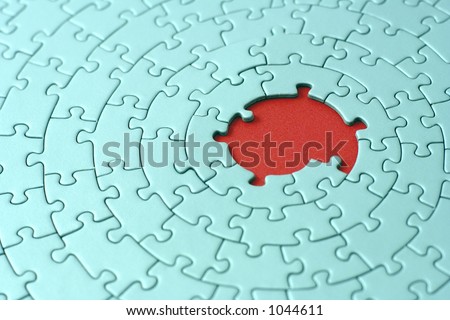 turquoise jigsaw with missing pieces in the red center - shallow DOF, focus is on the big hole