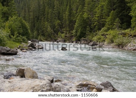 Lussier River in the Rocky Mountains - Creek with frigid water and strong current alongside hot pools