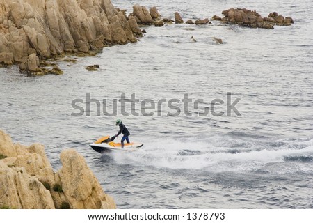 man riding a jet ski - thrill of aquatic sports