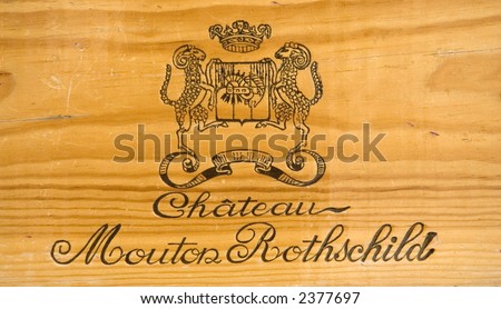 corporate logo of the famous winery chateau mouton-rothschild - on a wooden wine box