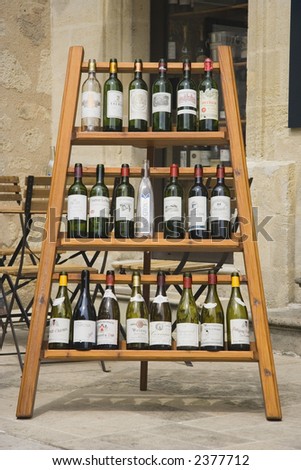 wine rack with empty wine bottles - saint-emilion, france