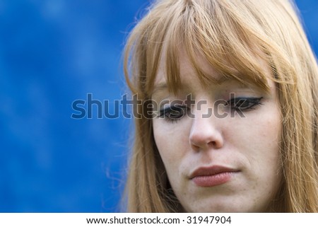 Sad Young Woman with Red Hair
