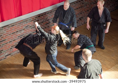 HERNE, GERMANY - MARCH 07: Young Masters of the Bushikan e.V. present techniques for efficient self-defense of women on March 07, 2009 in Herne, Germany.