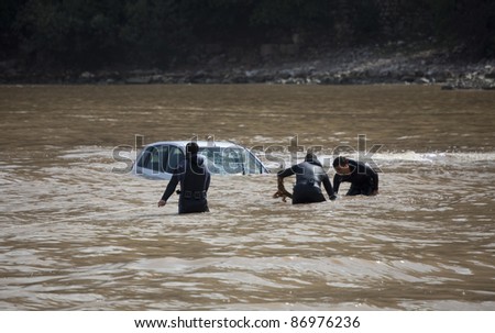 OLYMPOS, TURKEY - OCTOBER 14: Frogmen at rescue work after flood disaster on October 14, 2009 in Olympos, Turkey, Asia. The floods swept away about 50 cars and motor bikes.