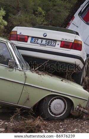 OLYMPOS, TURKEY - OCTOBER 14: Close-up of wedged cars after flood disaster on October 14, 2009 in Olympos, Turkey. The floods destroy roads and houses and swept away about 50 cars.