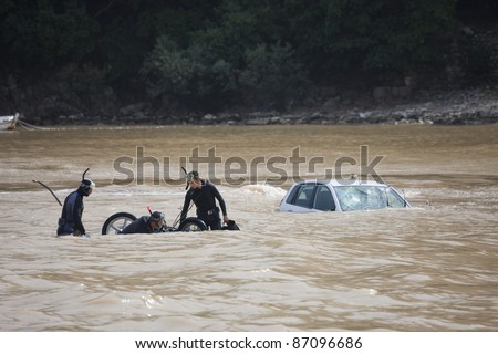 OLYMPOS, TURKEY - OCTOBER 14: Frogmen do rescue work after flood disaster on October 14, 2009 in Olympos, Turkey. The floods swept away about 50 cars and motorcycles from the road into the sea.