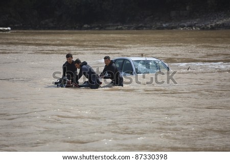 OLYMPOS, TURKEY - OCTOBER 14: Frogmen doing rescue work after flood disaster on October 14, 2009 in Olympos, Turkey, Asia. The floods swept away about 50 cars and motor bikes.