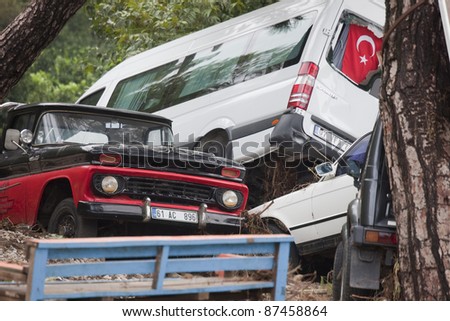 OLYMPOS, TURKEY - OCTOBER 14: Crashed cars in the woods after flood disaster on October 14, 2009 in Olympos, Turkey, Asia. The floods destroy roads and houses and swept away about 50 cars.