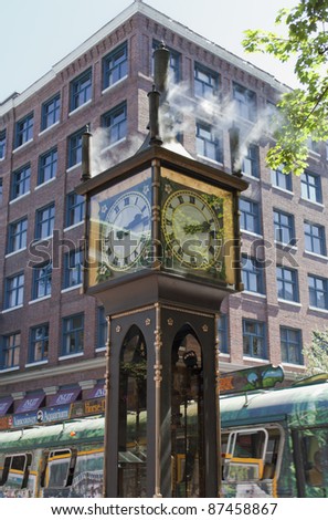 VANCOUVER, CANADA - AUGUST 06: Street Scene with Steam Clock in Gastown, Vancouver, Canada on August 06, 2005. Gastown is a national historic site of Canada and a popular tourist attraction.
