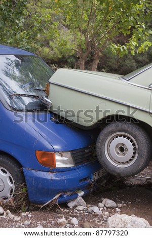 OLYMPOS, TURKEY - OCTOBER 14: Close-up of wedged cars after flood disaster on October 14, 2009 in Olympos, Turkey. The floods destroy roads and houses and swept away about 50 cars.