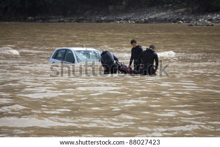 OLYMPOS, TURKEY - OCTOBER 14: Frogmen doing rescue work after flood disaster on October 14, 2009 in Olympos, Turkey. The floods swept away about 50 cars and motorcycles from the road into the sea.