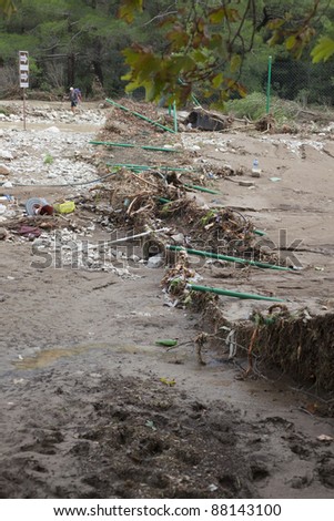 OLYMPOS, TURKEY - OCTOBER 14: A destroyed chain-link fence lies in ruins after flood disaster on October 14, 2009 in Olympos, Turkey. The floods destroyed roads, houses and swept away about 50 cars.