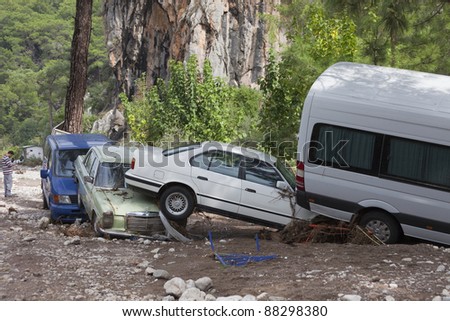 OLYMPOS, TURKEY - OCTOBER 14: Wedged cars in the woods after flood disaster on October 14, 2009 in Olympos, Turkey, Asia. The floods  destroy  roads and houses and swept away about 50 cars.