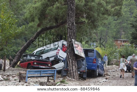 OLYMPOS, TURKEY - OCTOBER 14: Crashed cars in the woods after flood disaster on October 14, 2009 in Olympos, Turkey, Asia. The floods destroyed roads and houses and swept away about 50 cars.