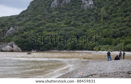 OLYMPOS, TURKEY - OCTOBER 14: Damaged cars after flood disaster on October 14, 2009 in Olympos, Turkey, Asia. The flood destroyed houses and swept away about 50 cars from the road into the sea.
