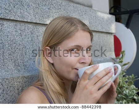 Young Woman drinking Coffee -  Victoria, Vancouver Island, British Columbia, Canada