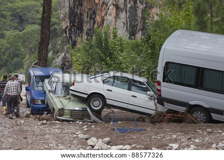 OLYMPOS, TURKEY - OCTOBER 14: Crashed cars in the woods after flood disaster on October 14, 2009 in Olympos, Turkey, Asia. The floods destroy  roads and houses and swept away about 50 cars.