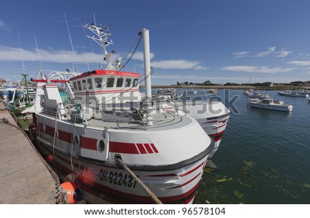 BARFLEUR, FRANCE - JULY 4: Trawler \'Le Millesime\' inn the harbor of Barfleur, France on July 4, 2011. It was constructed 2002. The length is nearly 15m and the motor has a power of 294 kw.
