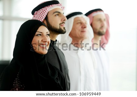 Successful and happy business arabic  people looking up,copyspace