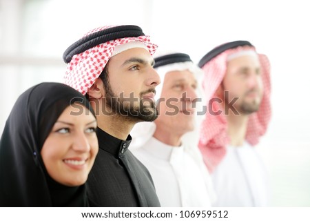 Successful and happy business arabic  people looking up