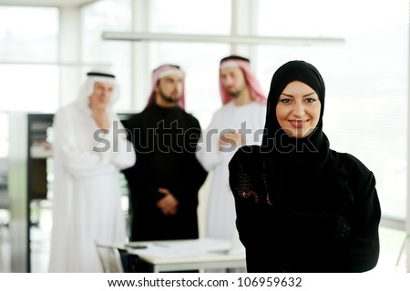 Arabic business woman working in team with her colleagues at office Arabic business woman working in team with her colleagues at office