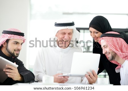 Business arabic people meeting indoor with electronic tablet