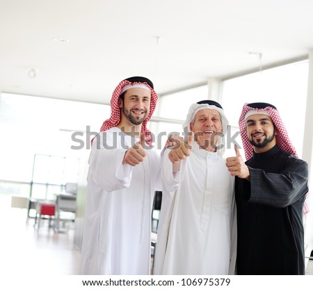 Successful and happy business arab people with thumbs up
