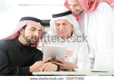 Business people at Middle east working on tablet PC