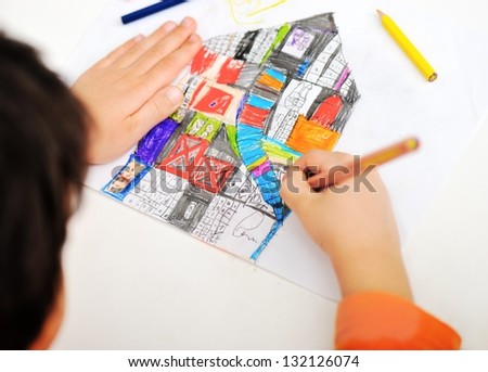 Childrens Hand With Pencil Draws The House