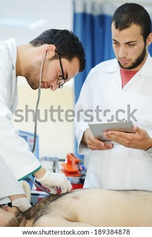 Medical workers taking care of patient at modern hospital