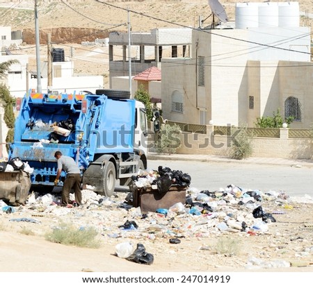 Garbage truck collecting trash