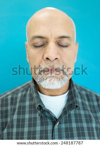 Senior Arabic Pakistani man studio portrait