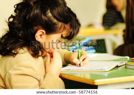 school child in classroom, cute girl