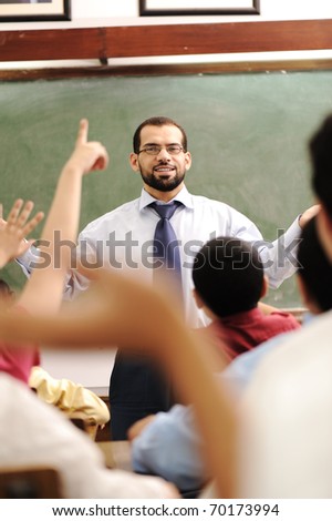 arabic kids in the school, classroom wit a teacher, rising hands and competition