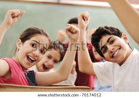 Happy children smiling and laughing in the classroom